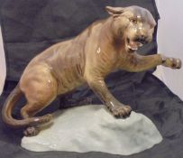 A Beswick glazed pottery figure of a Puma upon a rock (1702),