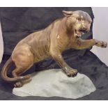 A Beswick glazed pottery figure of a Puma upon a rock (1702),