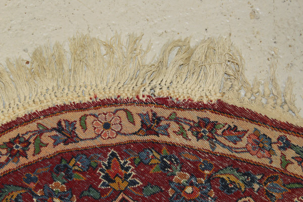 A Persian rug, the central panel set with stylised floral medallion on a red, blue and cream ground, - Image 13 of 34