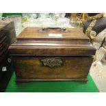 A George III mahogany tea caddy fitted with three lidded compartments raised on ogee bracket feet