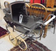 A Silver Cross doll's pram and a stained beech stick back high chair CONDITION REPORTS