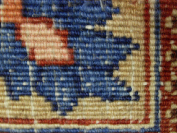 An Eastern rug, the central panel with all over foliate decoration on a midnight blue ground, - Image 6 of 9