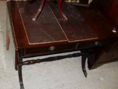 A modern mahogany drop-leaf sofa table in the Regency style bearing label inscribed "Manufactured