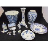 A Delft floral decorated bucket shaped vase, Delft blue and white candlestick,