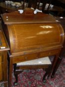 A circa 1900 mahogany and satinwood cross-banded cylinder top writing desk with fitted interior and