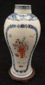 A Chinese blue and white baluster shaped vase polychrome decorated with vases of flowers