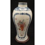 A Chinese blue and white baluster shaped vase polychrome decorated with vases of flowers