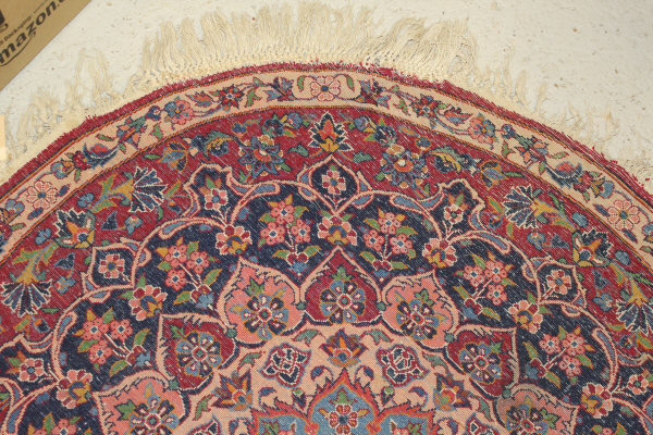 A Persian rug, the central panel set with stylised floral medallion on a red, blue and cream ground, - Image 14 of 34