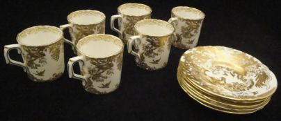 A set of six Royal Crown Derby china "Golden Aves" coffee cans and saucers, No'd.