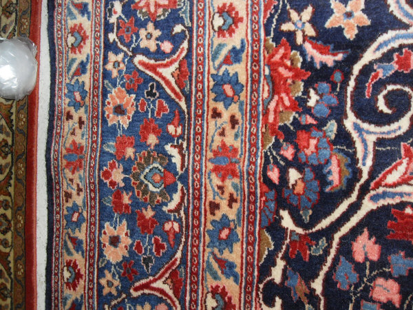 An Eastern rug, the central panel with all over foliate decoration on a midnight blue ground, - Image 4 of 9