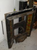 A Victorian cast iron and tiled fireplace (incomplete),