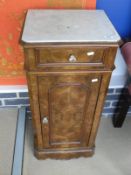 A 19th Century continental marble top walnut pot cupboard on walnut base with single drawer above a