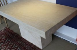 A rectangular stone table on single pedestal base