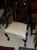 A late Victorian mahogany framed carver chair in the Chippendale taste,