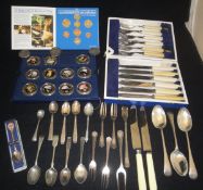 A collection of silver teaspoons with various dates and makers,