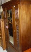 A Victorian mahogany single door wardrobe above a single drawer to plinth base