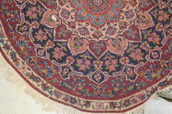 A Persian rug, the central panel set with stylised floral medallion on a red, blue and cream ground, - Image 16 of 34