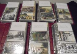 A box containing seven postcard albums containing various topographical postcards of varying