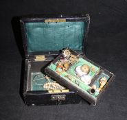 A leather jewellery box containing assorted jewellery to include a hardstone and pearl set ring