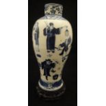 A Chinese blue and white baluster shaped vase decorated with various figures and Swastika emblems