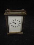 A 20th Century lacquered brass cased carriage clock,