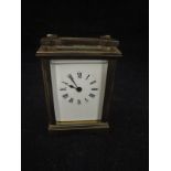 A 20th Century lacquered brass cased carriage clock,