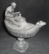 A Wedgwood black basalt urn shaped Vestal oil lamp decorated with seated figure reading,