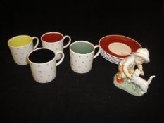 A Susie Cooper bone china part coffee set comprising four cups and five saucers with "Snowflake"