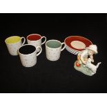 A Susie Cooper bone china part coffee set comprising four cups and five saucers with "Snowflake"
