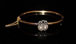A yellow metal bangle set with pearls and diamonds CONDITION REPORTS Measures approx