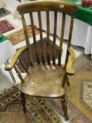A beech and elm Windsor elbow chair with stretchers