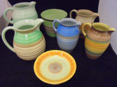 A collection of five Shelley banded ware jugs,