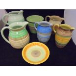 A collection of five Shelley banded ware jugs,