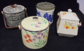 Four various biscuit barrels including an Arthur Wood silver shield,
