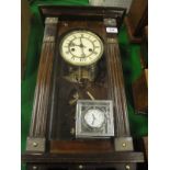 A circa 1900 Vienna type regulator wall clock and a Jens Olsen Quartz timepiece with stainless