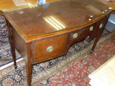 A circa 1900 mahogany bow front sideboard with central single door flanked by cupboard door on