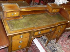 A 19th Century mahogany and cross-banded desk with brass galleried superstructure above a green