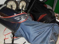 A golf bag and trolley containing various M T Tourney golf clubs signed by MacGregor and a Dunlop