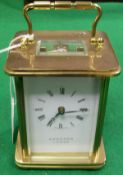 A modern brass cased carriage clock, the movement by Matthew Norman of Switzerland, No'd.