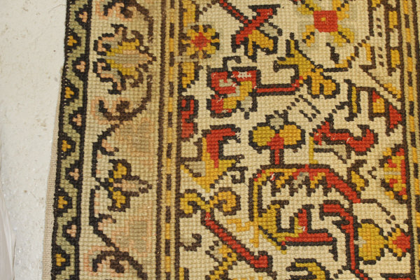 A Persian rug, the central panel set with stylised floral medallion on a red, blue and cream ground, - Image 24 of 34