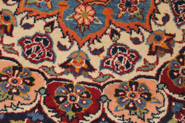 A Persian rug, the central panel set with stylised floral medallion on a red, blue and cream ground, - Image 11 of 34