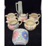 Four various Arthur Wood floral decorated jugs,