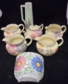 Four various Arthur Wood floral decorated jugs,