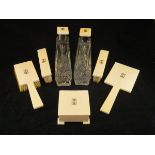 A George V ivory dressing table set of seven pieces comprising three brushes, mirror,