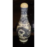 A Chinese porcelain gourd-shaped scent bottle decorated in blues with five toed dragon,