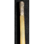 A 19th Century rhino horn swagger stick with Chinese white metal pommel embossed with two figures