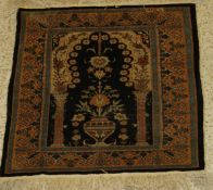 A fine silk prayer rug, the central panel set with Mihrab design on a black and cream ground,