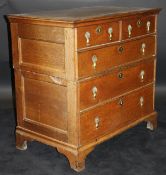 An 18th Century oak chest with a Cavetto moulded top,