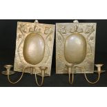 A pair of Edwardian Arts and Crafts Newlyn School copper wall sconces by John Pearson,