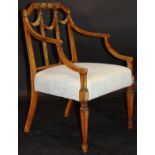 An Edwardian satinwood and painted elbow chair in the Sheraton Revival taste,